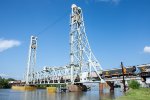 Grain hoppers rolls across the Neches River Lift Bridge